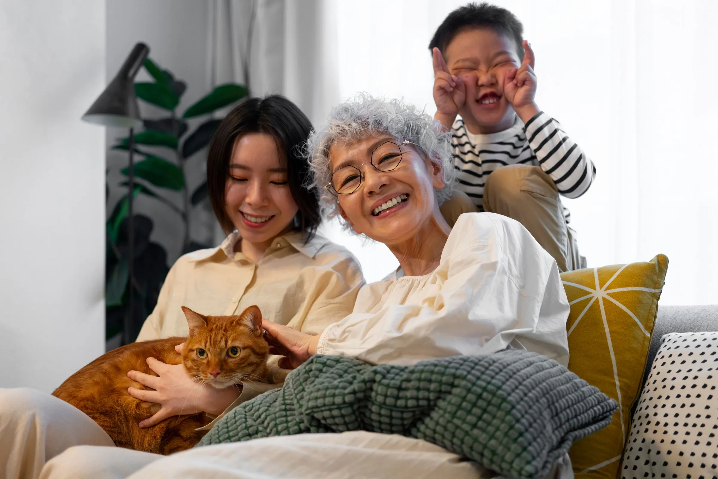 A family at home together with their cat